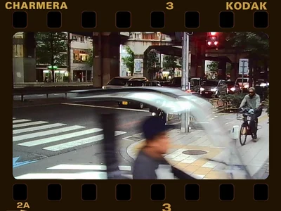 Stock frame 1: a dark 35 mm film strip with sprocket holes and edge printing around the photo.